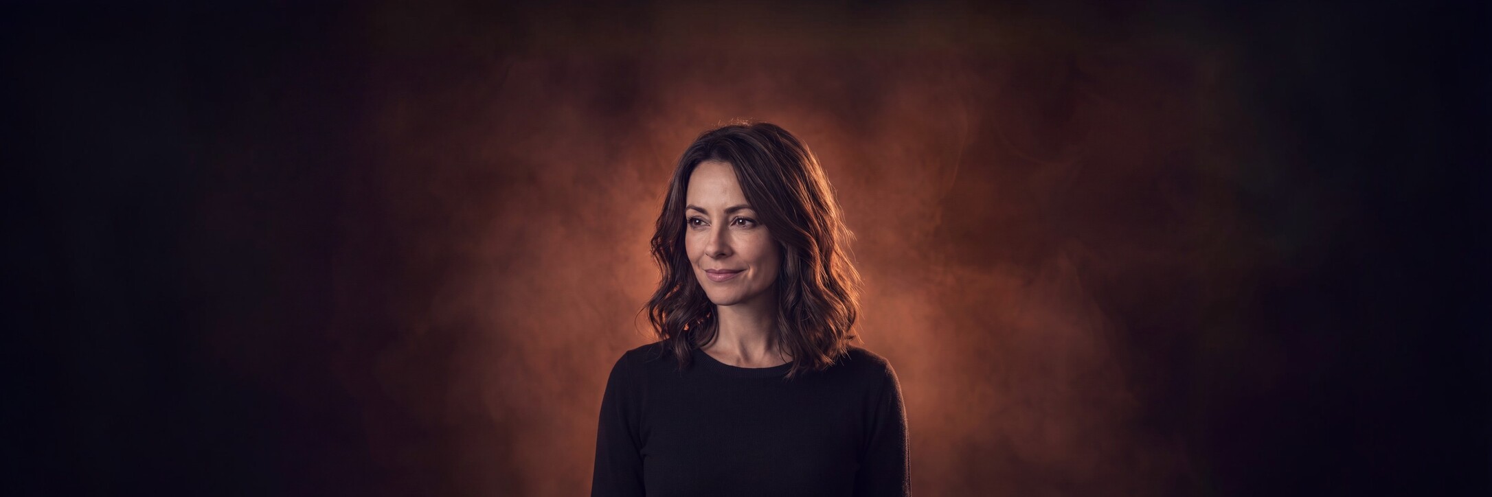 A smiling woman with shoulder-length hair